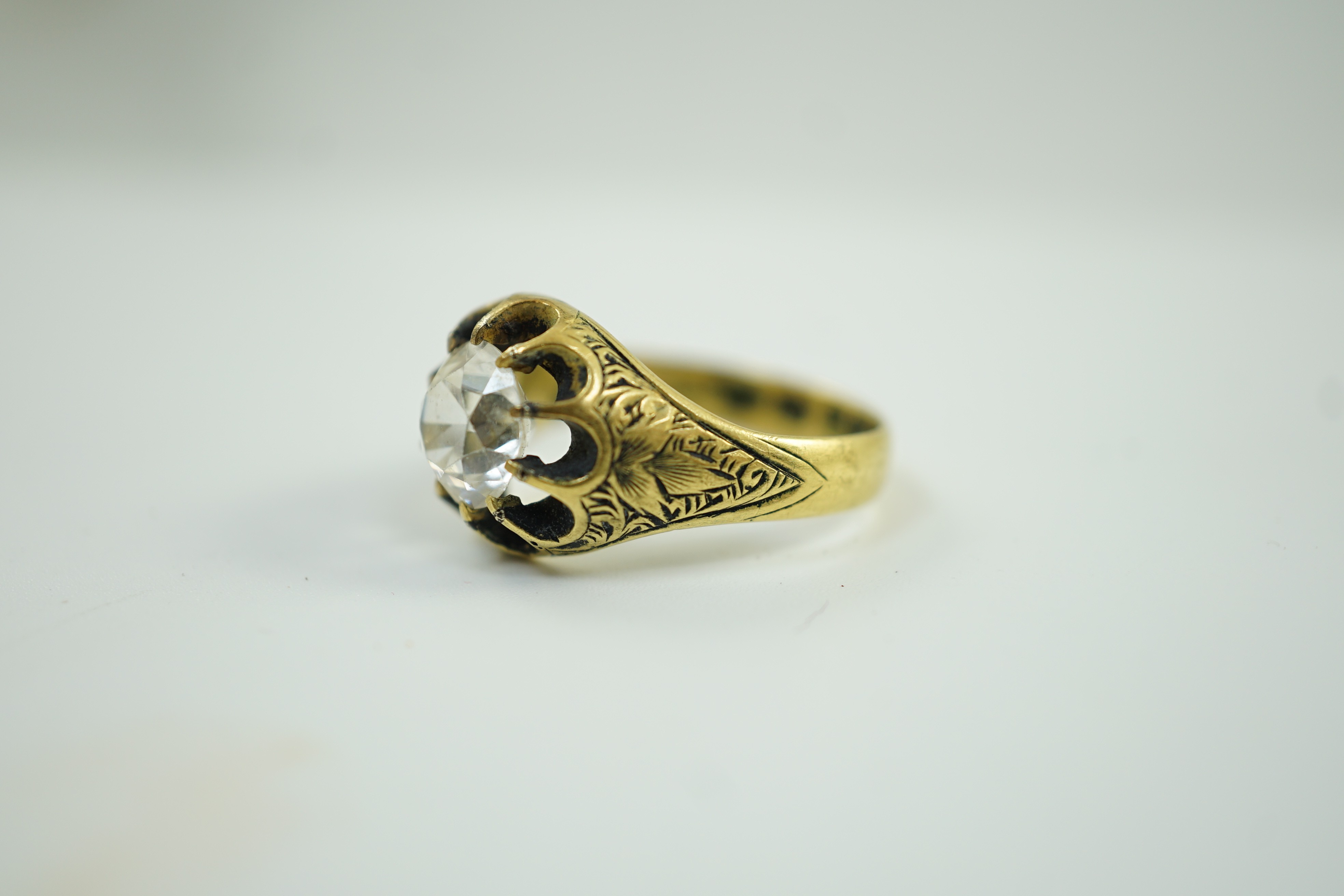 An Edwardian 18ct gold and single stone claw set white zircon? ring, size O, size 7 grams.